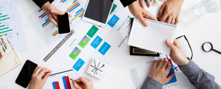 businessmen-hands-white-table-with-documents-drafts 1